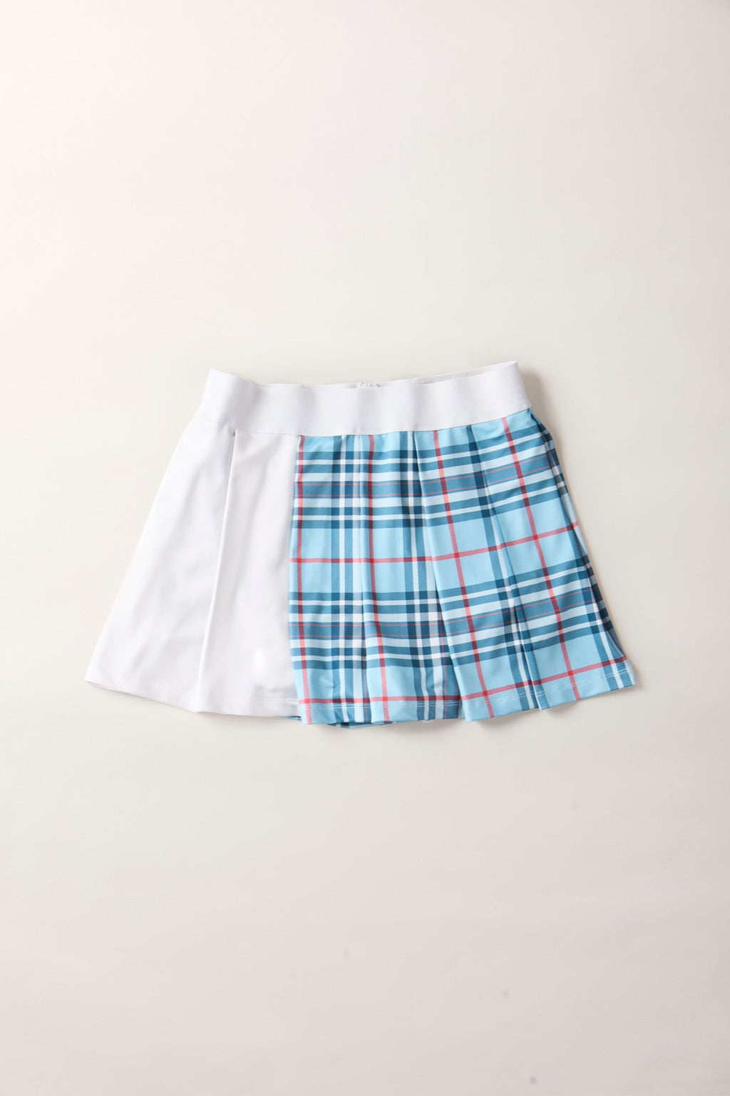 THE AGGIE BLUE PLAID SKORT— POLISHED PLAID FOR PLAY, PRACTICE, AND POST-MATCH PLANS