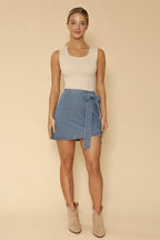 Asymmetrical denim bow skirt