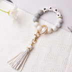 BAOSIWA Women Silicone Keychain Bracelet Beaded Wristlet Key Ring Christmas White Bangle Chains with Leather Tassel